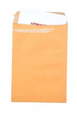 Open Manila Envelope with Approved Brand Mission peaking out