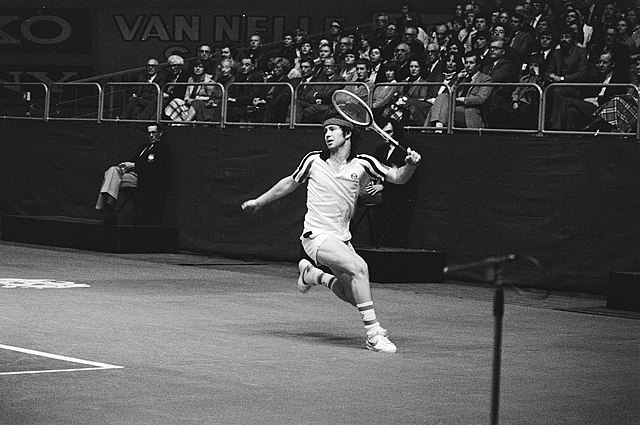 John McEnroe running on a tennis court in 1979