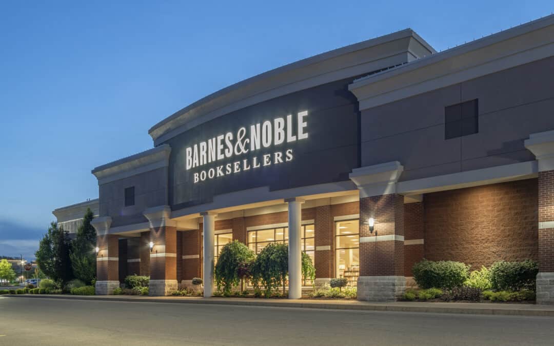 New Hartford, New York - Aug 18, 2019: Barnes and Noble Booksellers store at dusk, with the store logo illuminated against a deep blue sky